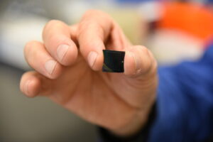 Man holding a diagnostic chip in his hand